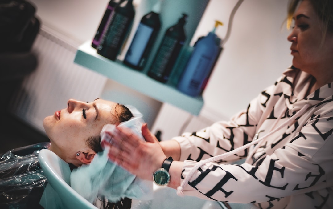 a-man-getting-his-hair-washed-in-a-salon-po3kb8d1vts